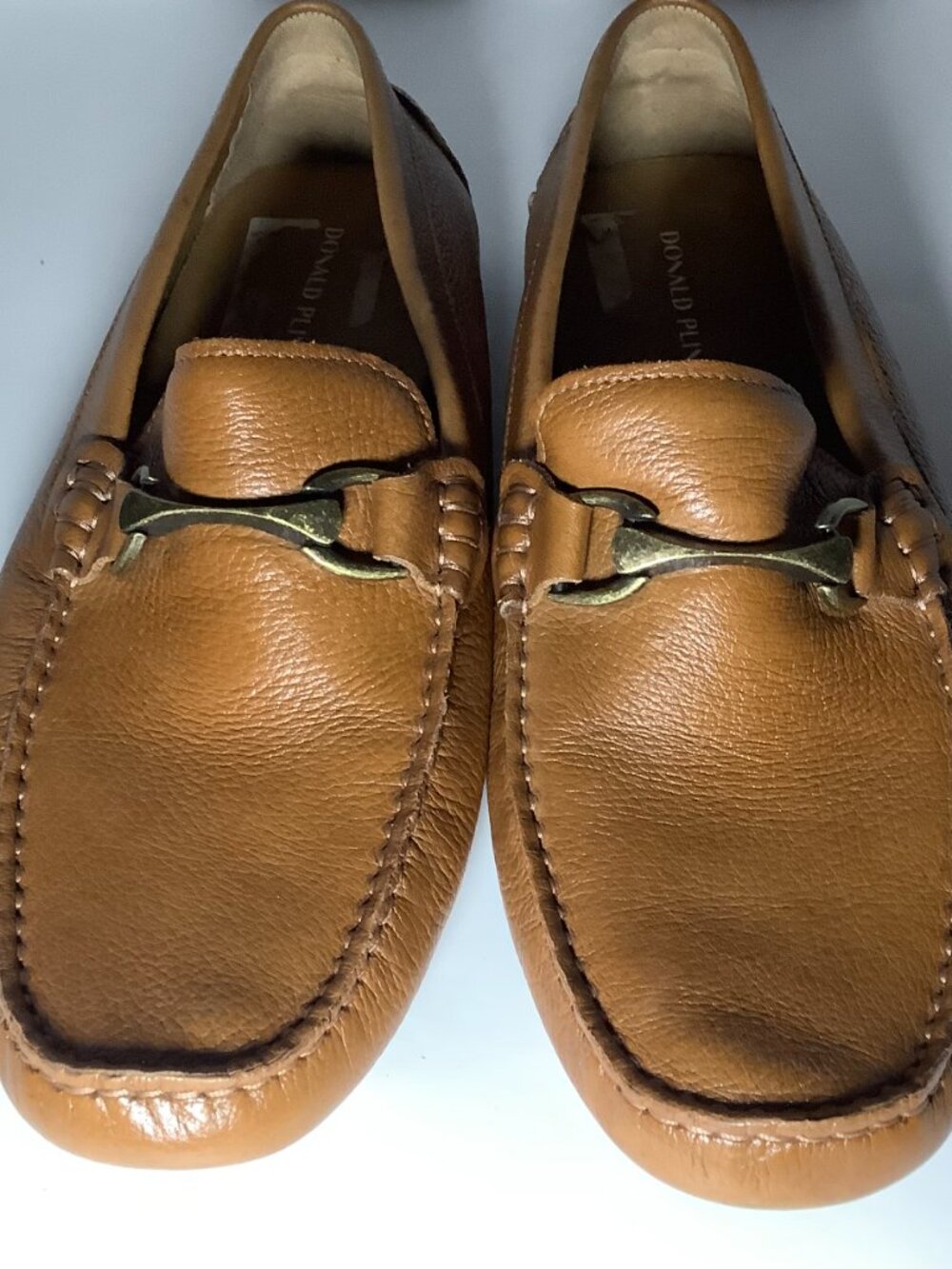 Authentic Donald Pliner genuine leather loafers in a beautiful cognac brown